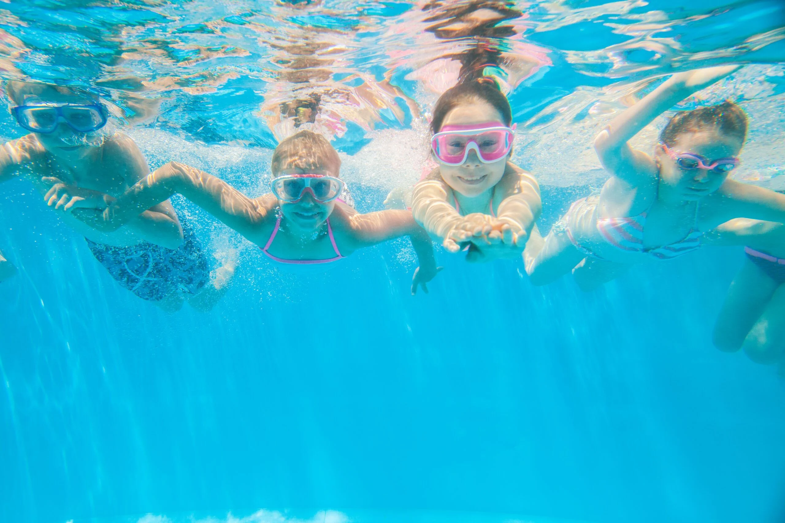 Family enjoying heated pool