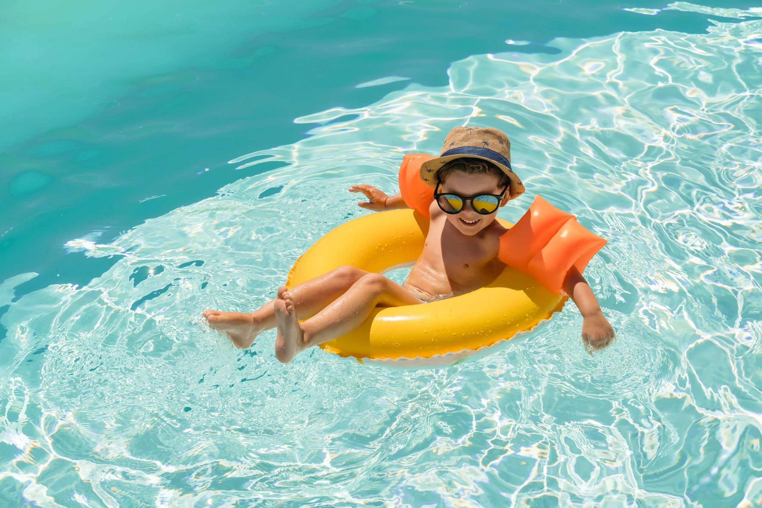 Family enjoying a heated swimming pool